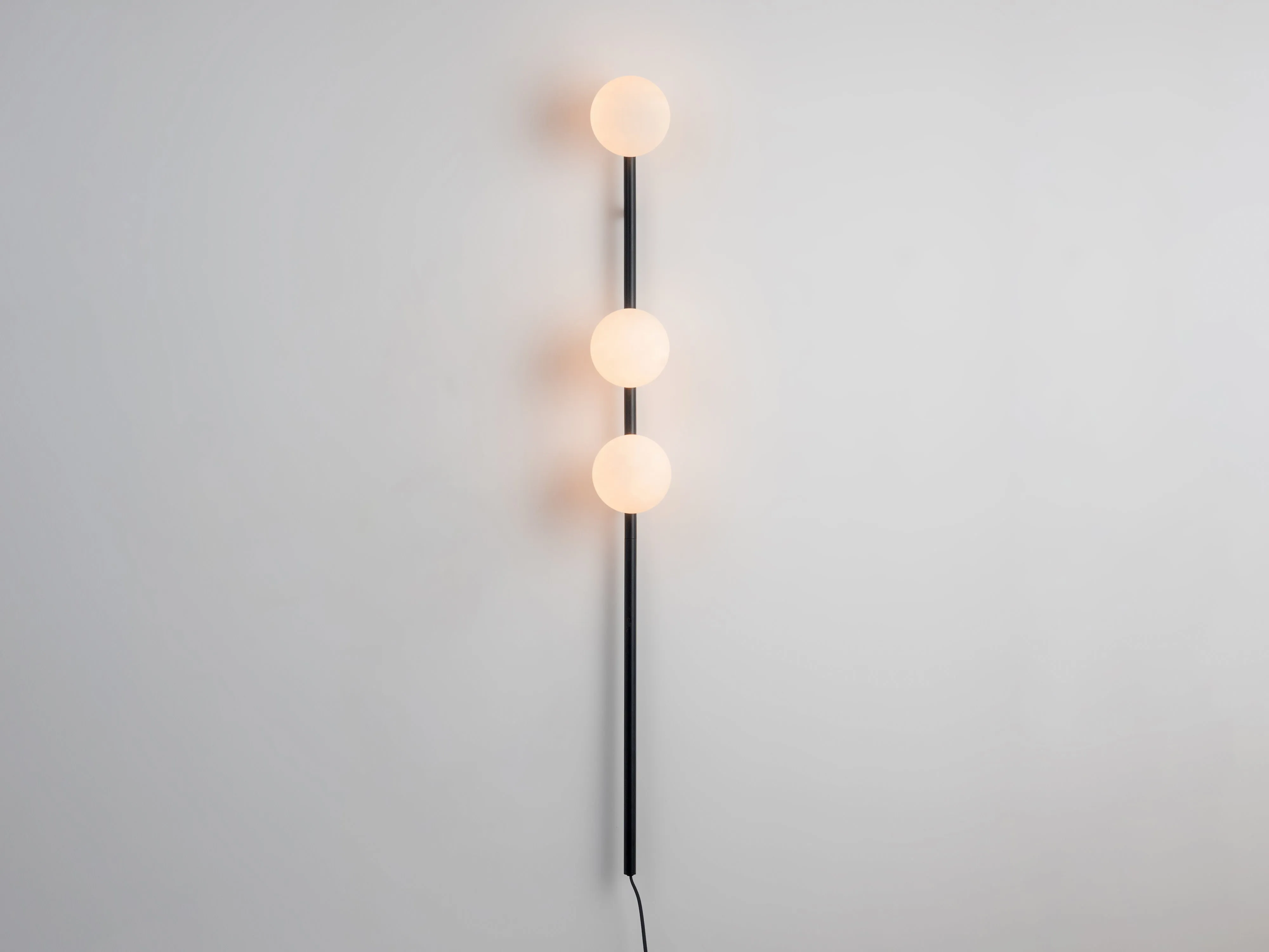 Charcoal grey bar opal ball wall light