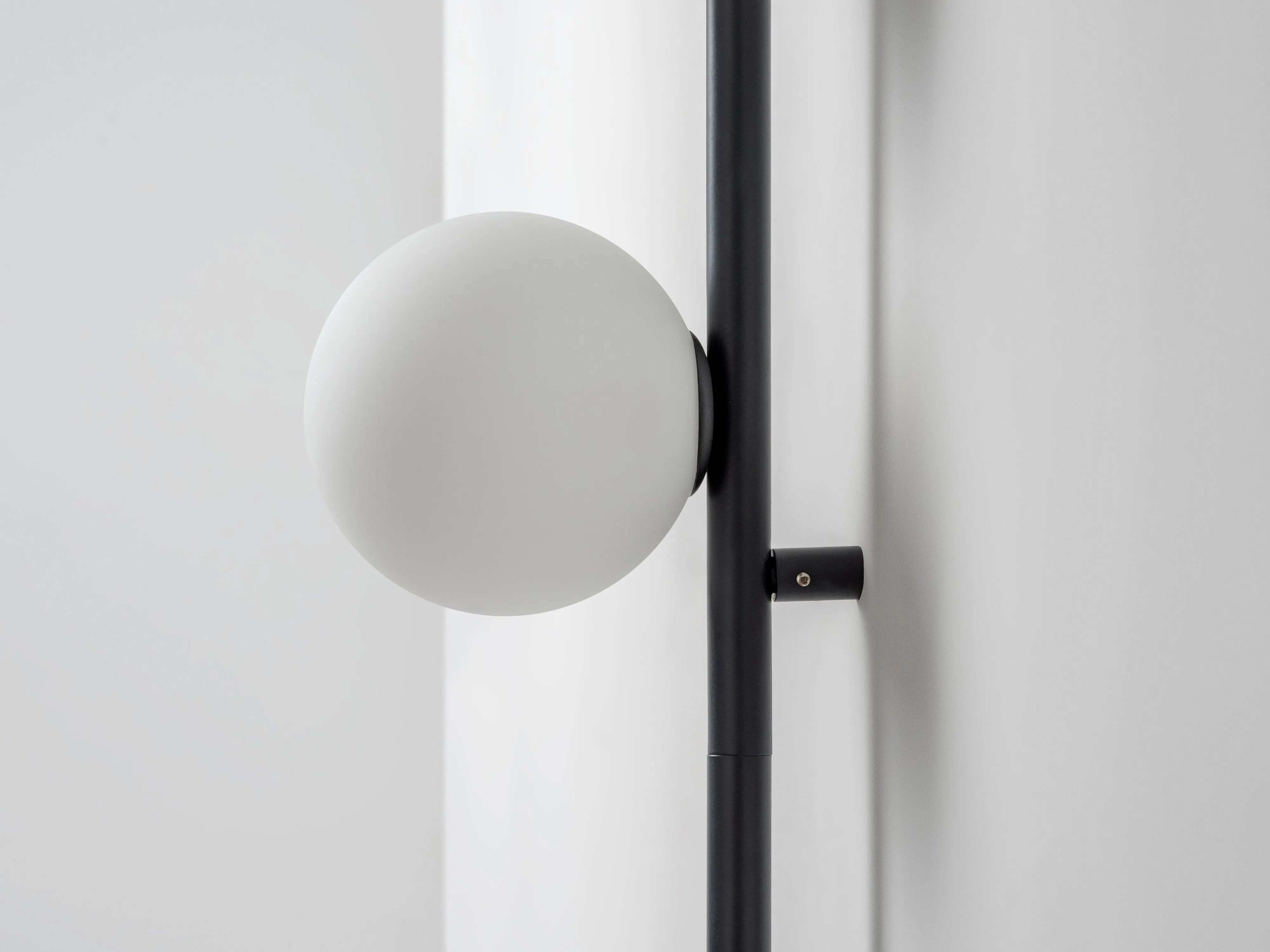 Charcoal grey bar opal ball wall light