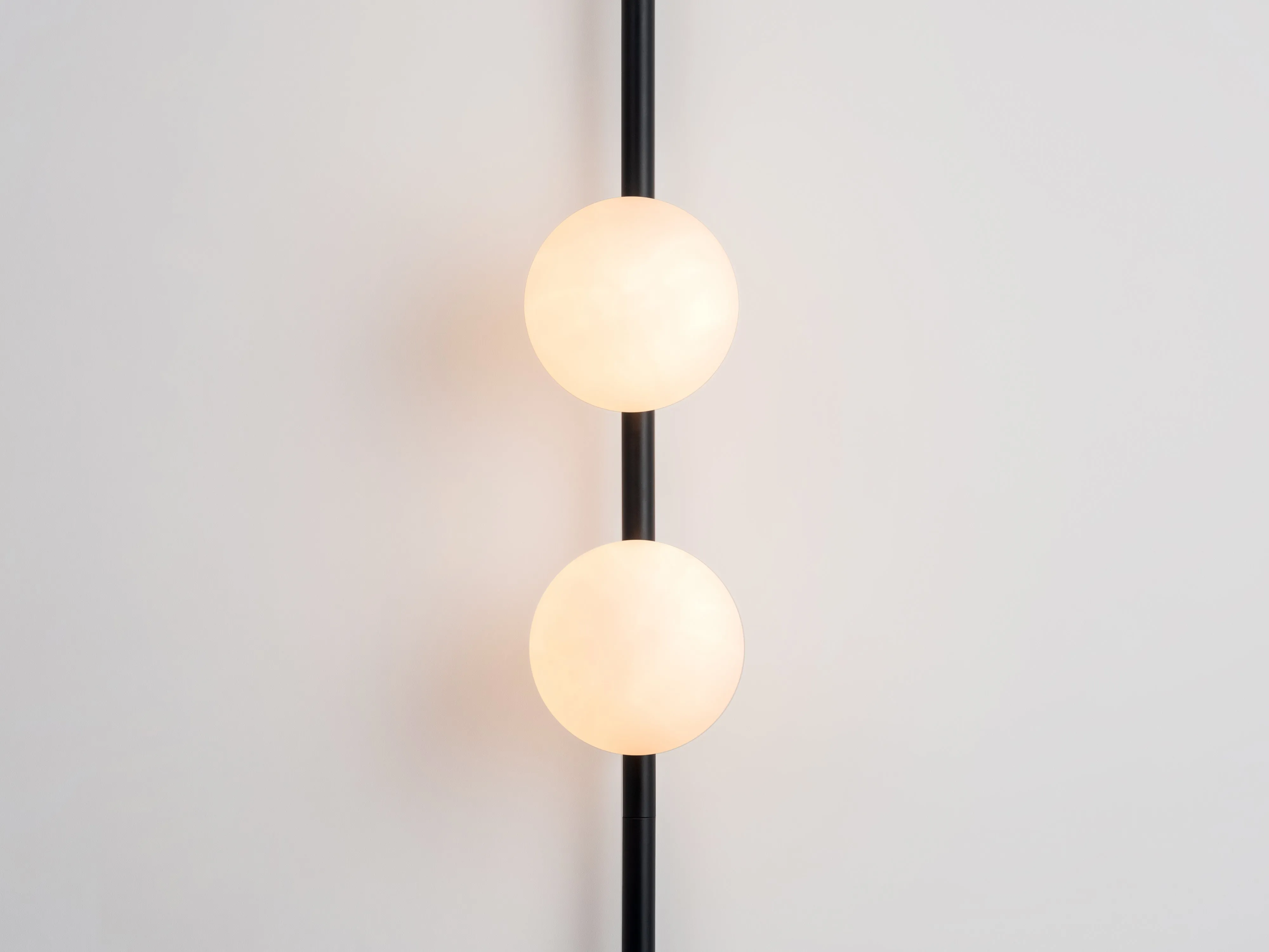 Charcoal grey bar opal ball wall light